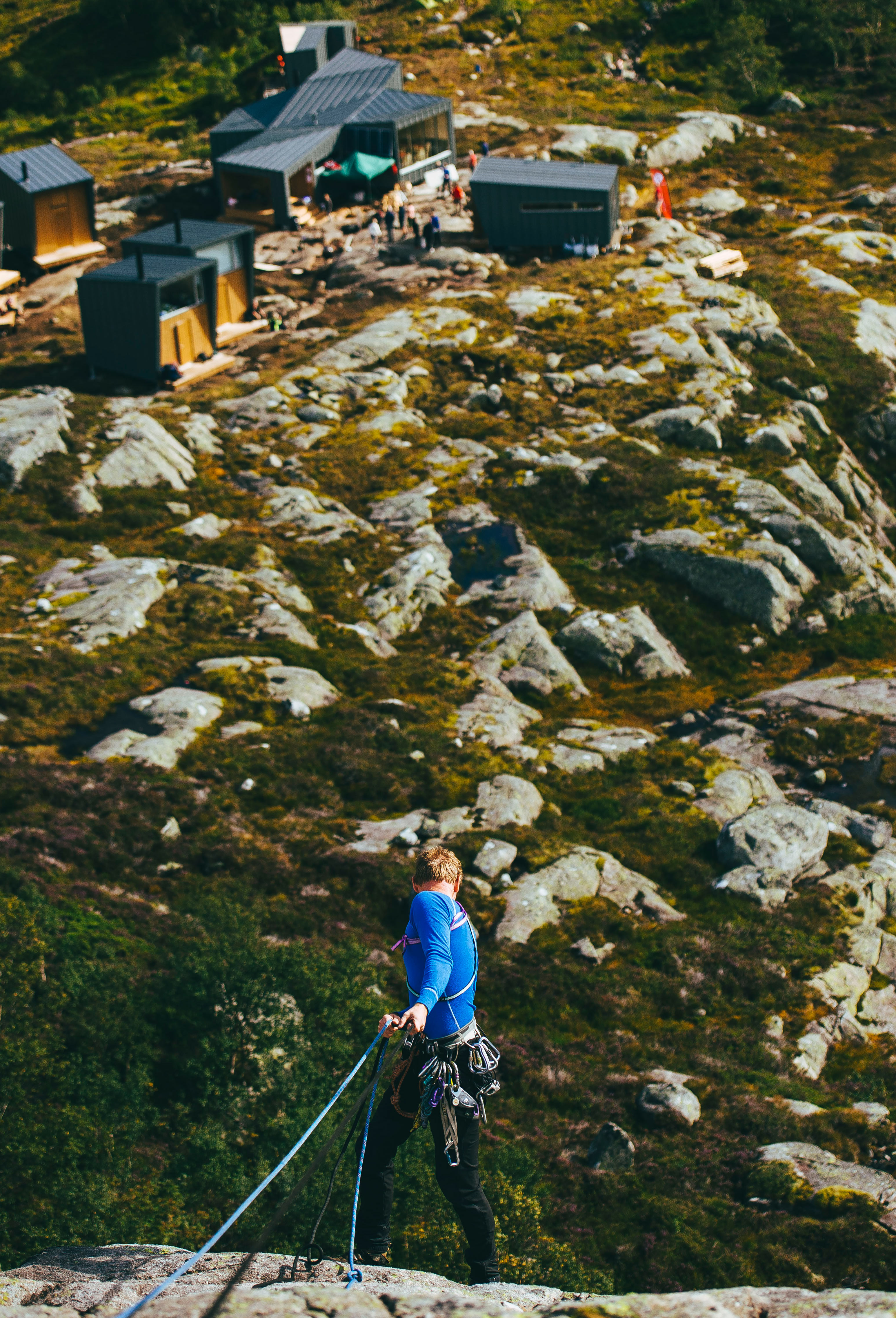 Climbing hills next to cabins