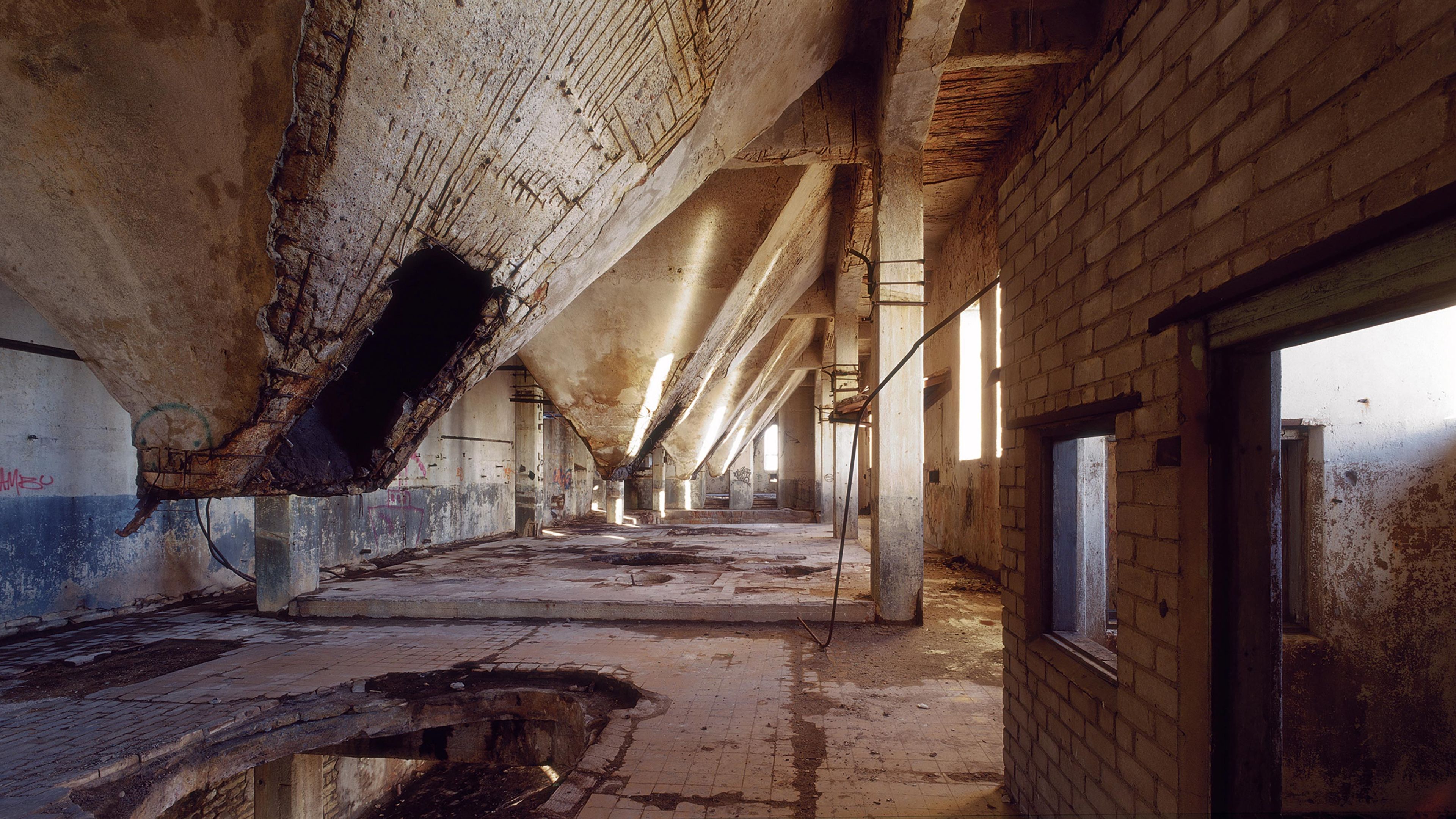 View to silos of chopped wood, 2004. Currently office and 2 loft apartments, bathrooms in the pyramides