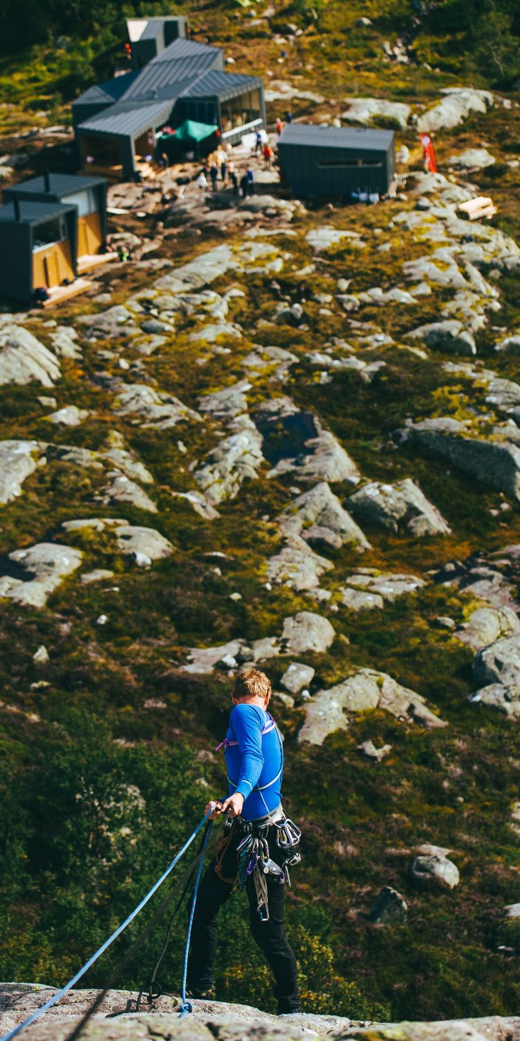 Climbing hills next to cabins